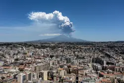 Italy’s Mount Etna erupts in smoky display sending panicked tourists running for safety